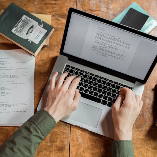 a person typing on a laptop 